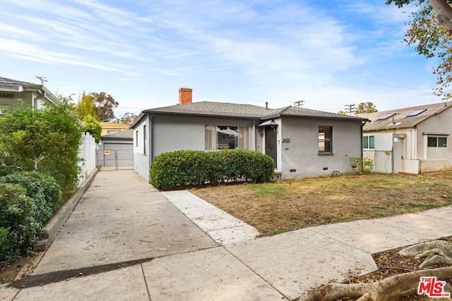 bungalow-style house with an outbuilding and a garage