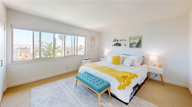 bedroom featuring light colored carpet