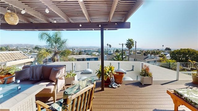 wooden terrace featuring a pergola and a mountain view