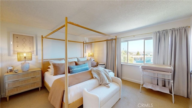 bedroom featuring carpet flooring and a textured ceiling