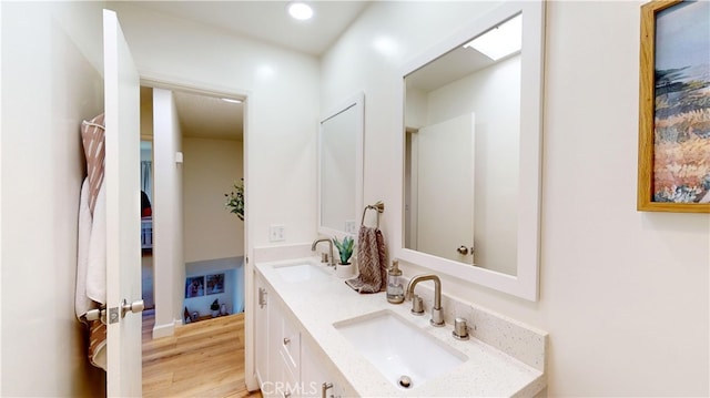 bathroom featuring hardwood / wood-style floors and vanity