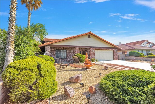 ranch-style house featuring a garage