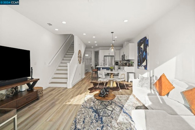 living room with light hardwood / wood-style floors