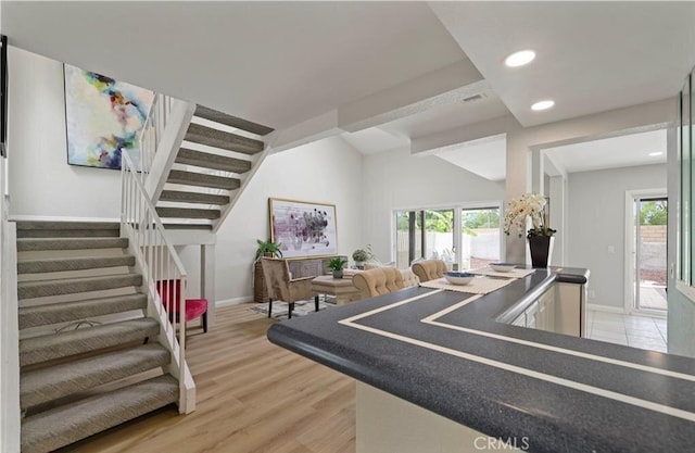 playroom featuring hardwood / wood-style floors, a healthy amount of sunlight, and vaulted ceiling