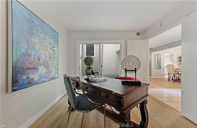 home office featuring light hardwood / wood-style floors