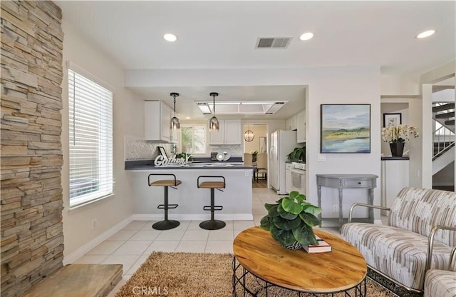 living room with light tile patterned flooring