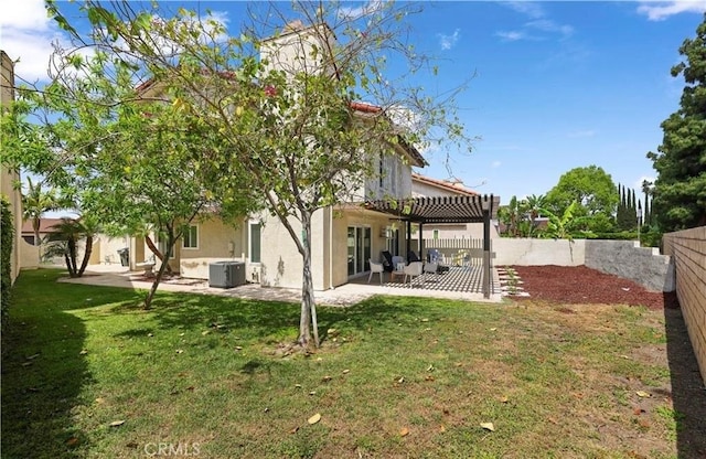 back of property featuring a lawn, a patio area, and central air condition unit