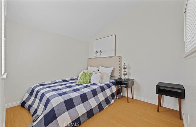 bedroom with hardwood / wood-style floors