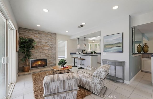 tiled living room with a fireplace