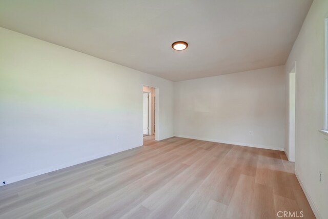 empty room with light hardwood / wood-style floors