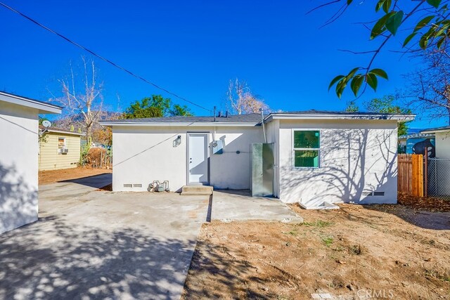 rear view of property featuring a patio