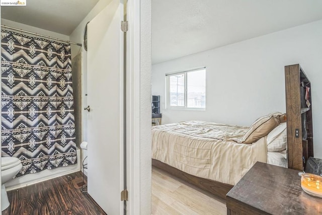 bedroom featuring wood-type flooring