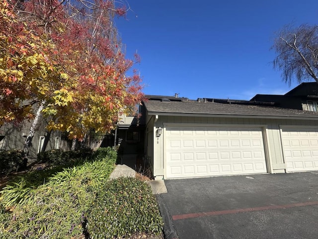 view of property exterior featuring a garage