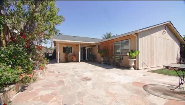 rear view of house featuring a patio