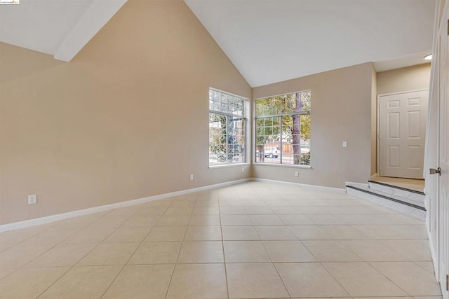 tiled empty room with high vaulted ceiling