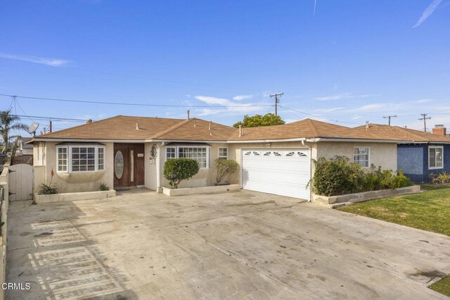 ranch-style home featuring a garage