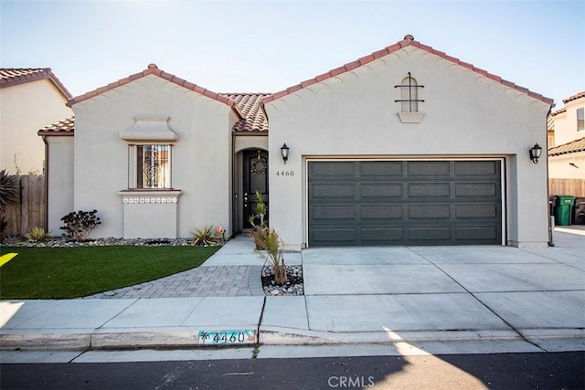 mediterranean / spanish-style house featuring a garage