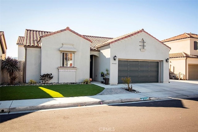 mediterranean / spanish-style home featuring a garage