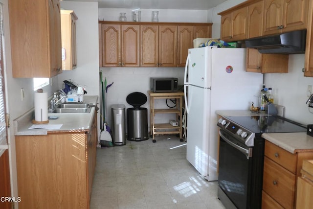 kitchen featuring black range with electric stovetop and sink