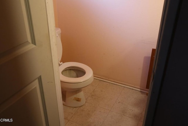 bathroom featuring tile patterned flooring and toilet