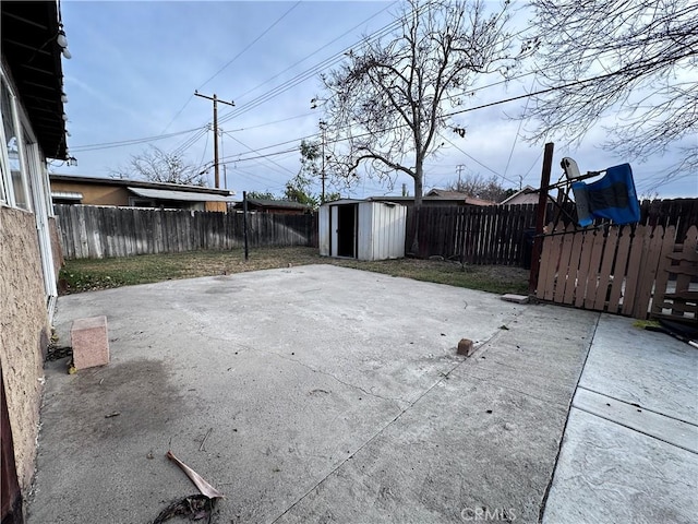 view of patio / terrace with a shed