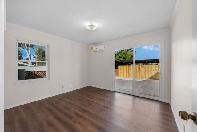 spare room with baseboards, dark wood-type flooring, an AC wall unit, and ornamental molding