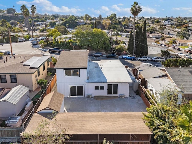 birds eye view of property with a residential view