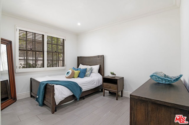 bedroom featuring crown molding