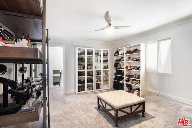 interior space with ceiling fan, crown molding, and light colored carpet