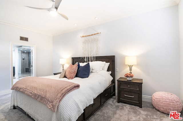 carpeted bedroom with ensuite bath, ceiling fan, and crown molding