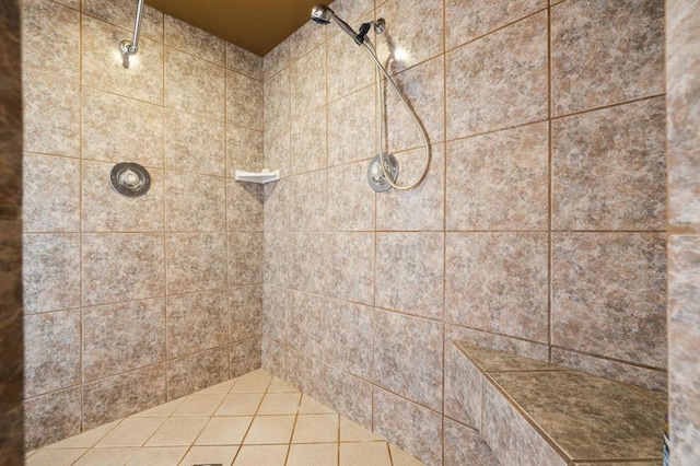 bathroom with a tile shower