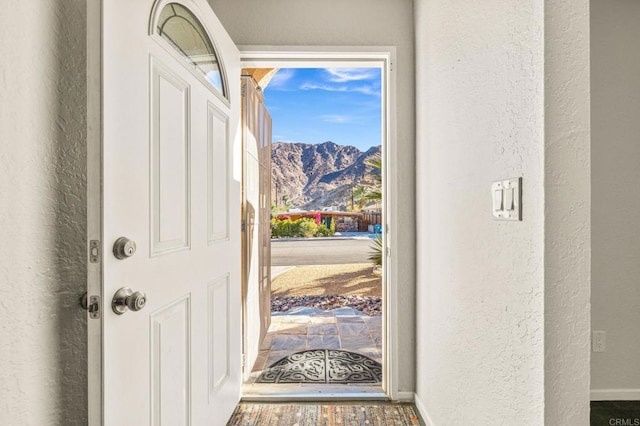 foyer entrance with a mountain view