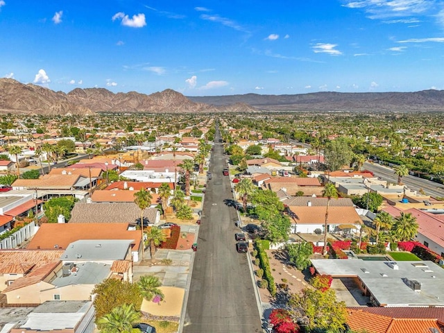 birds eye view of property featuring a mountain view