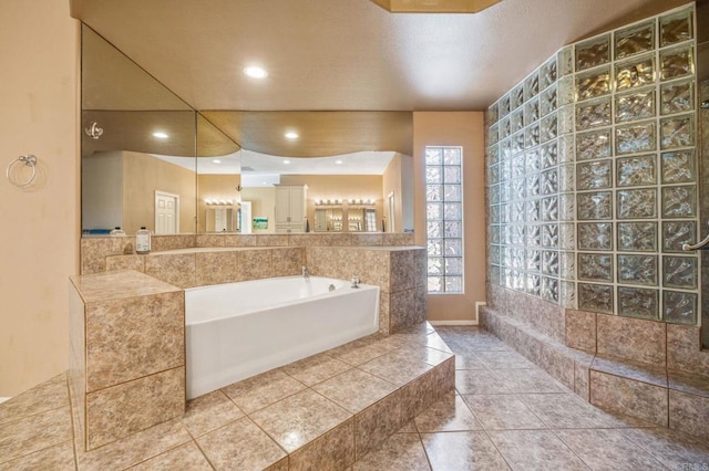 bathroom featuring tiled bath