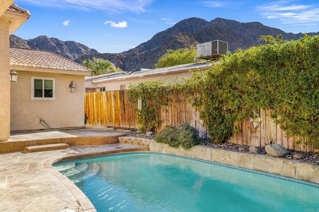 view of swimming pool featuring a mountain view