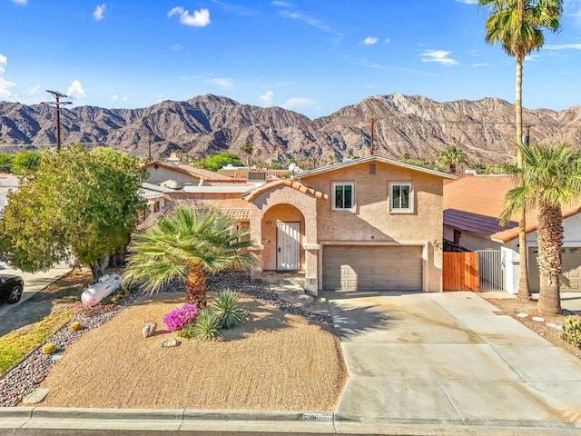 view of front of house featuring a mountain view and a garage