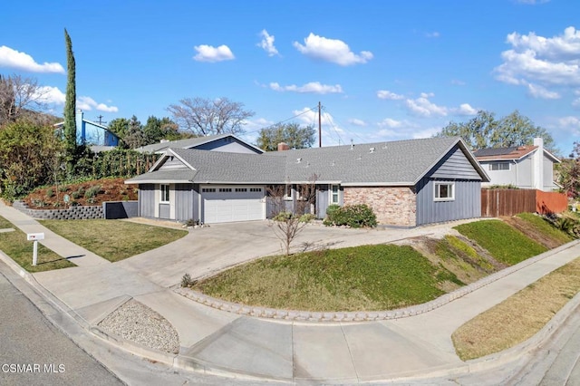 view of front of house featuring a front yard and a garage