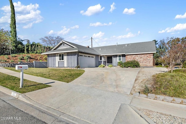 single story home with a garage and a front lawn