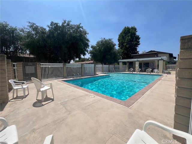 view of swimming pool with a patio