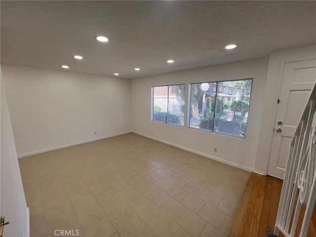 empty room featuring a textured ceiling