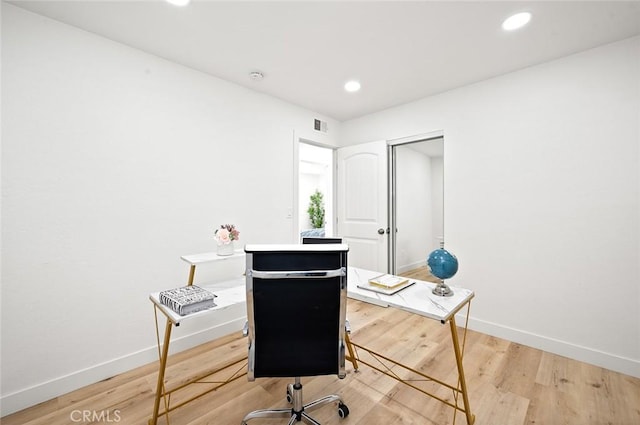 home office with light wood-type flooring