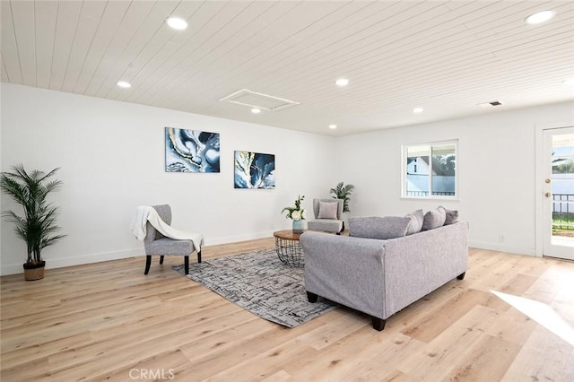 living room with light hardwood / wood-style flooring and wooden ceiling