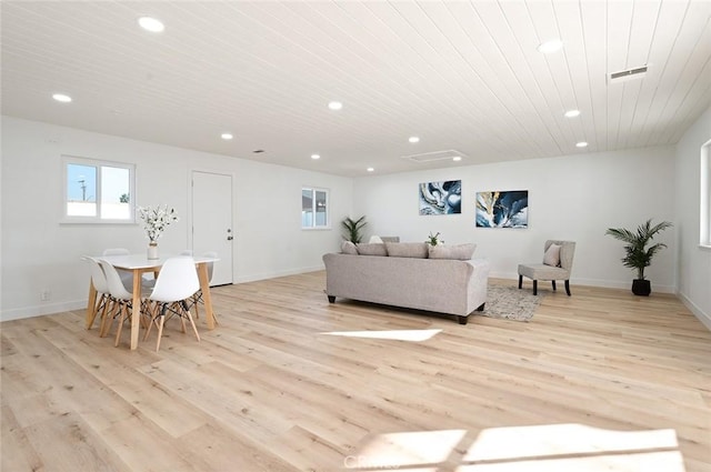 living room featuring light hardwood / wood-style floors and wood ceiling