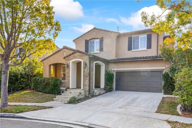 mediterranean / spanish house featuring a garage