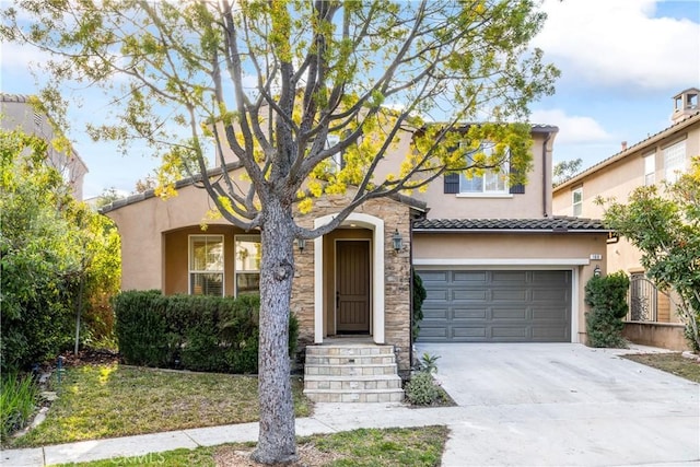 mediterranean / spanish-style house with a garage