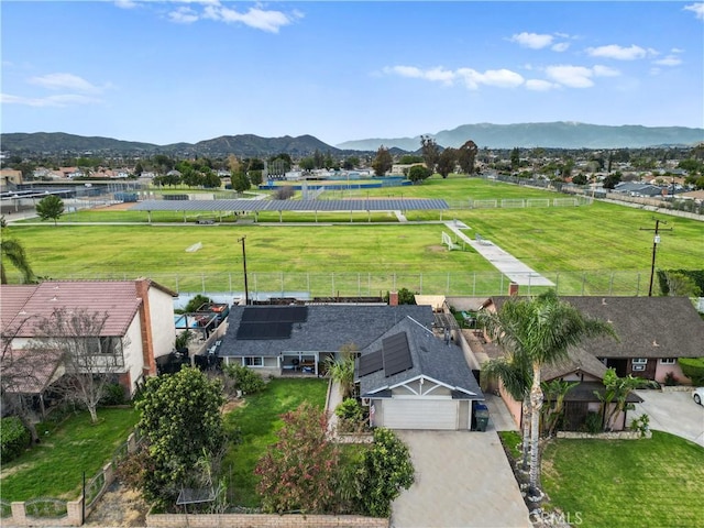 birds eye view of property featuring a mountain view