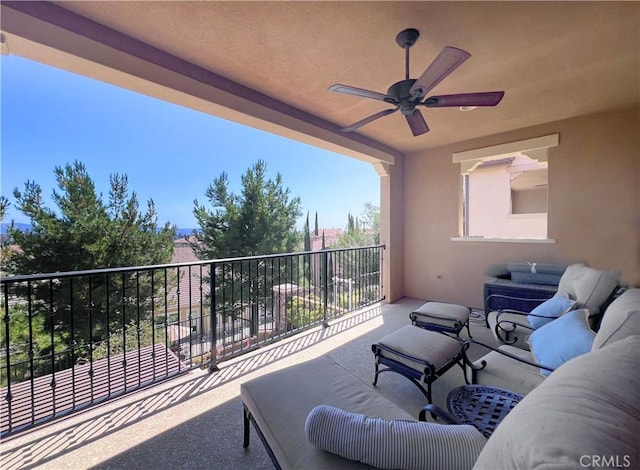 view of patio / terrace with an outdoor living space, a balcony, and ceiling fan