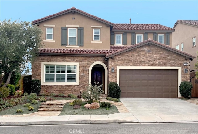 mediterranean / spanish-style home featuring a garage