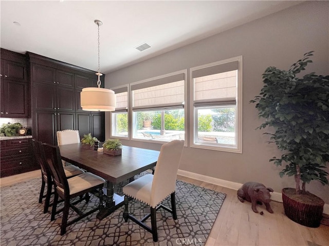 dining area with light wood-type flooring