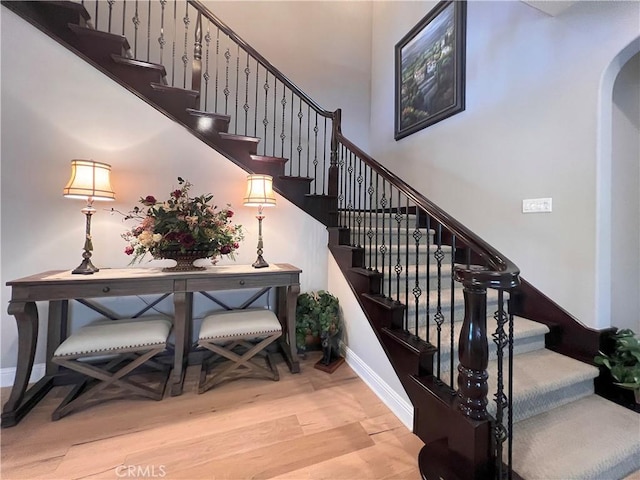 staircase featuring hardwood / wood-style floors